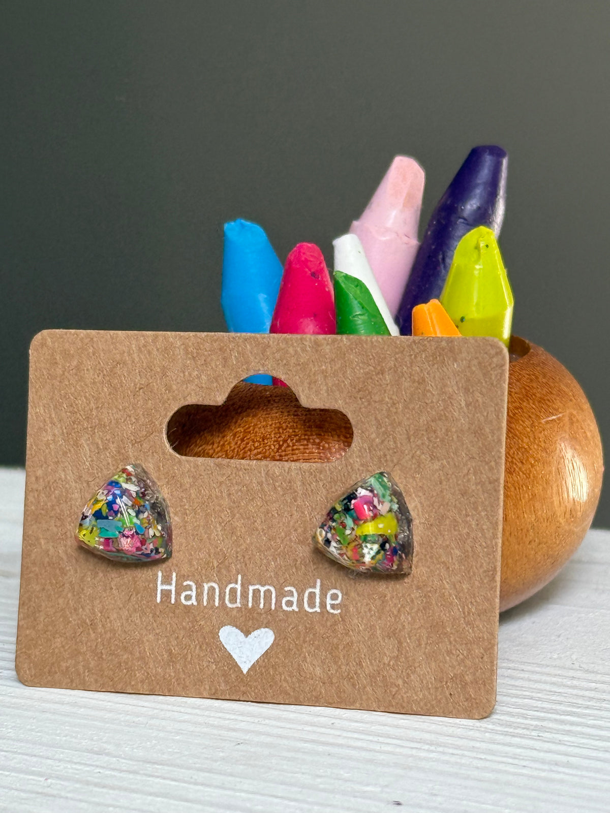 small colorful studs made with recycled crayons. Our crayon jewelry are a joyful pop-of-color made from our mother-daughter studio in Atlanta, GA.
