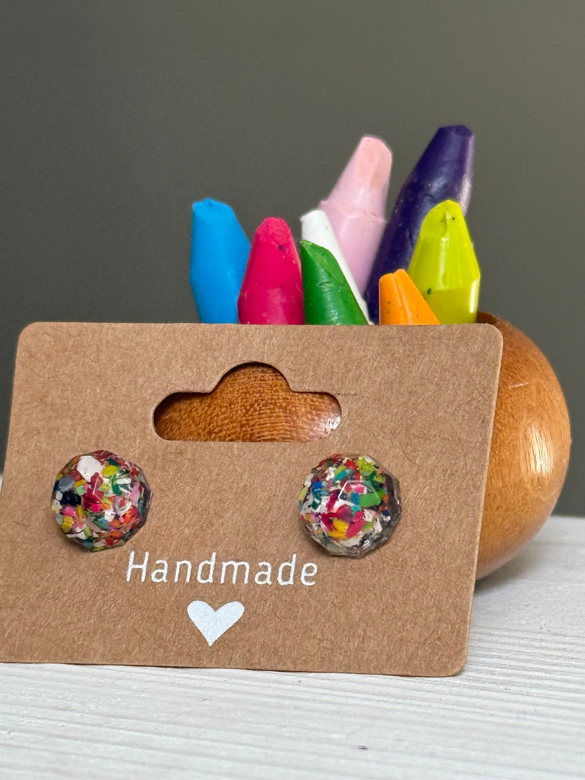 small colorful studs made with recycled crayons. Our crayon jewelry are a joyful pop-of-color made from our mother-daughter studio in Atlanta, GA.