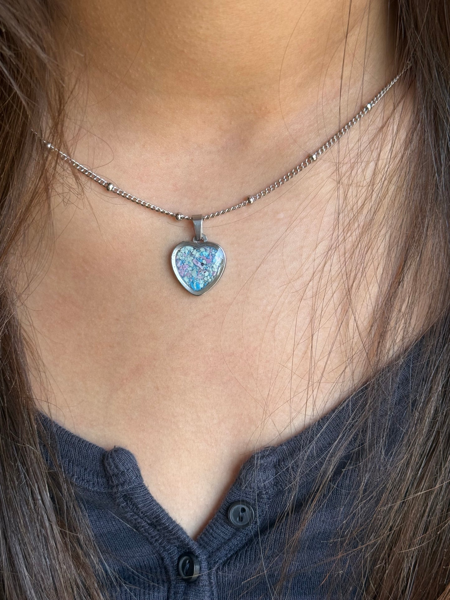 Pink, blush, and rose small heart stainless steel pendant filled with crayon shavings. Dainty necklace. Crayonfetti crayon jewelry by mother-daughter based in Atlanta, Georgia.