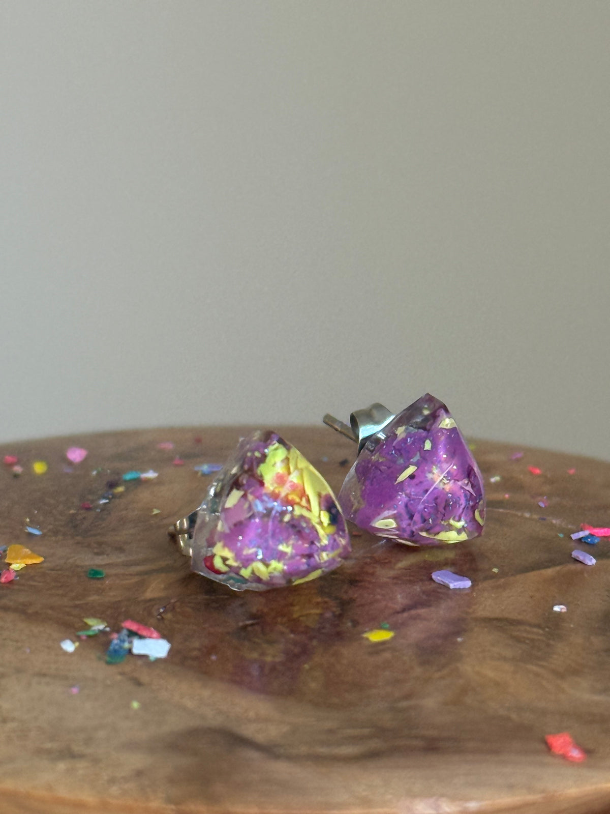 small colorful studs made with recycled crayons. Our crayon jewelry are a joyful pop-of-color made from our mother-daughter studio in Atlanta, GA.