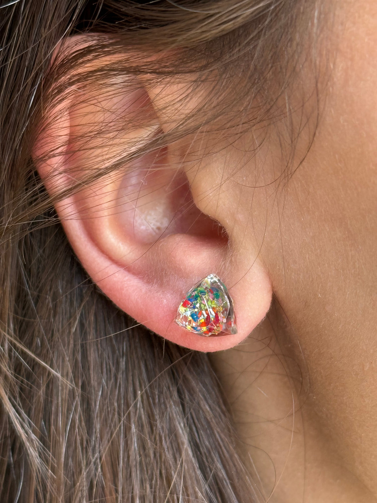 small colorful studs made with recycled crayons. Our crayon jewelry are a joyful pop-of-color made from our mother-daughter studio in Atlanta, GA.