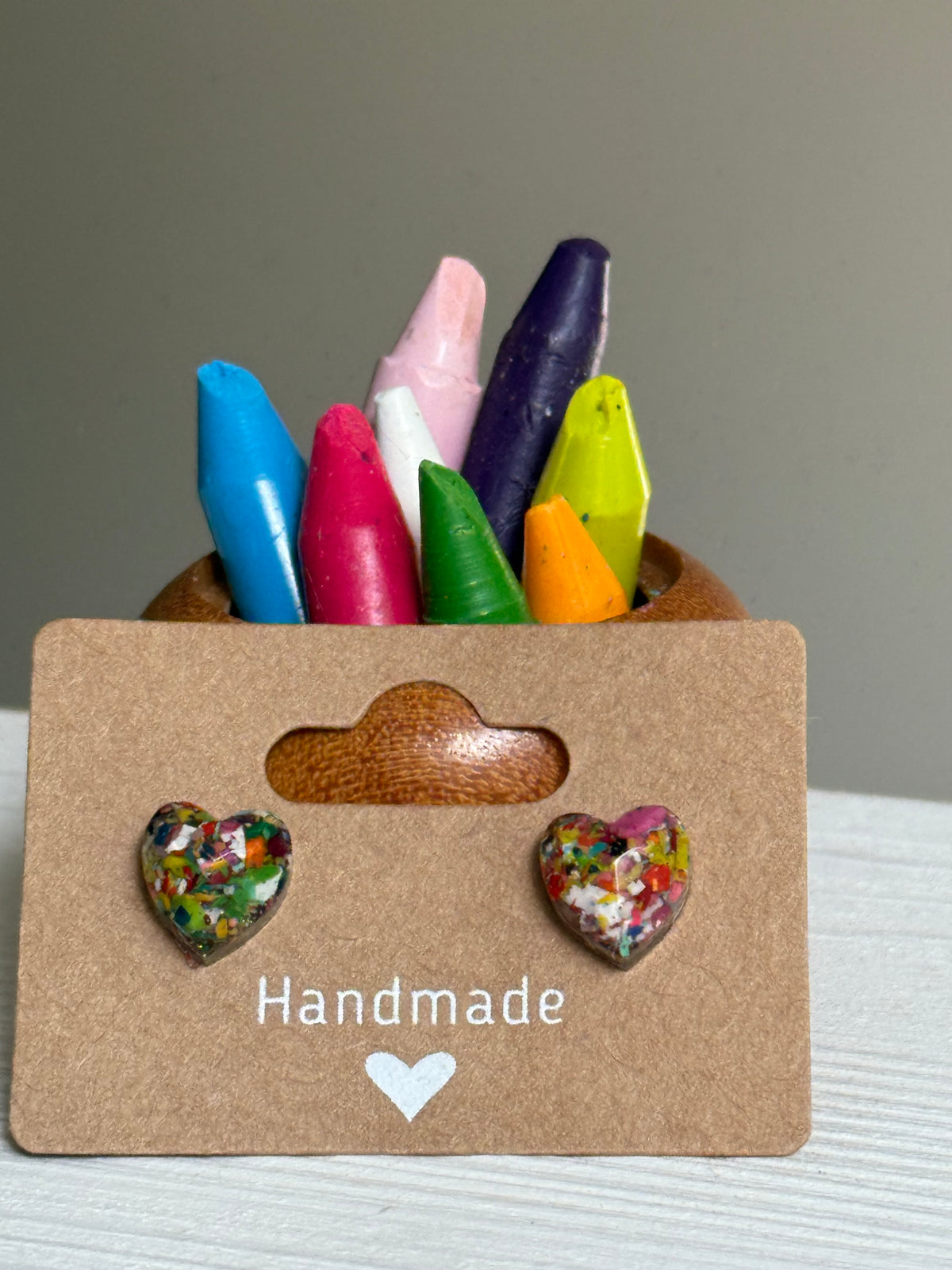 small colorful studs made with recycled crayons. Our crayon jewelry are a joyful pop-of-color made from our mother-daughter studio in Atlanta, GA.