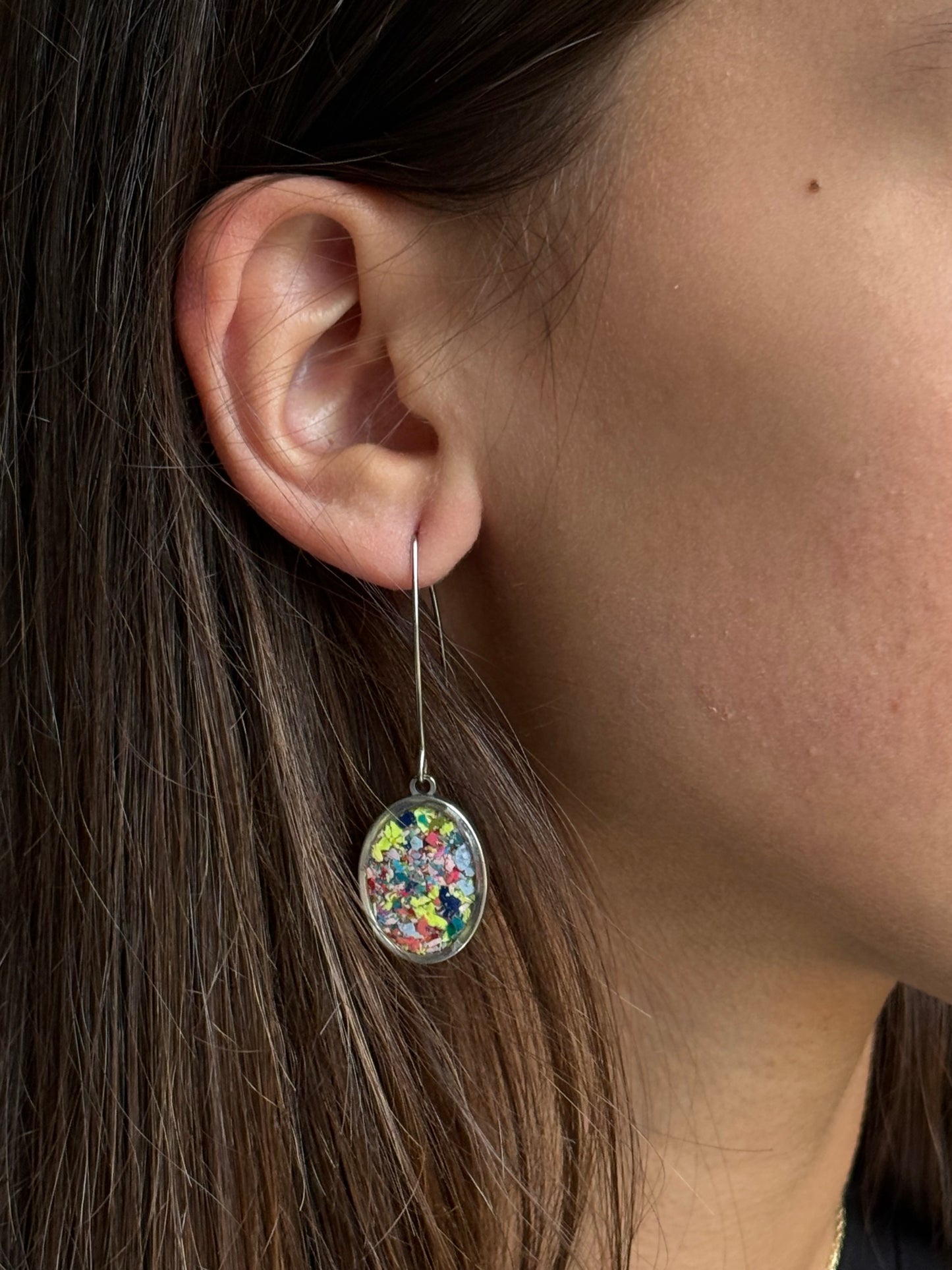 Our Prisma earrings are handcrafted with recycled crayons. Lightweight and colorful statement earrings. A vibrant and joyful sustainable jewelry statement from our mother-daughter studio in Atlanta, GA.