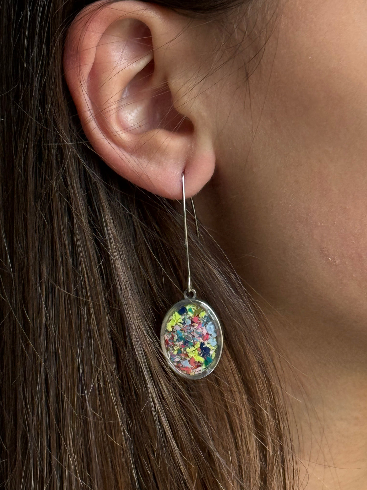 Our Prisma earrings are handcrafted with recycled crayons. Lightweight and colorful statement earrings. A vibrant and joyful sustainable jewelry statement from our mother-daughter studio in Atlanta, GA.