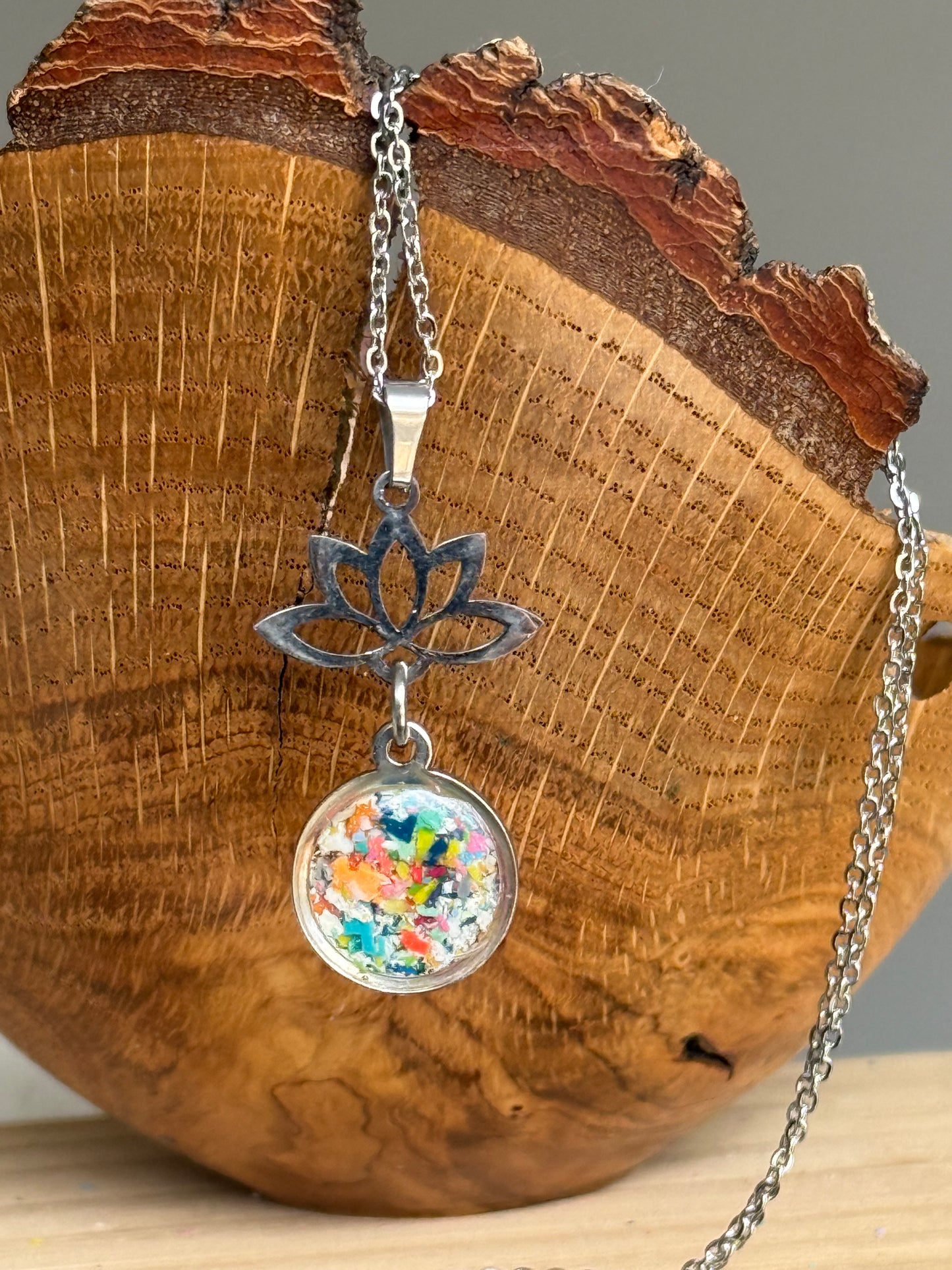 Lotus flower and Multicolor round stainless steel pendant filled with crayon shavings. Dainty necklace. Crayonfetti crayon jewelry by mother-daughter based in Atlanta, Georgia.
