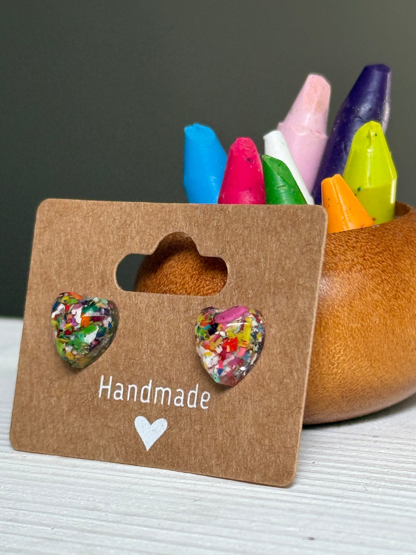 small colorful studs made with recycled crayons. Our crayon jewelry are a joyful pop-of-color made from our mother-daughter studio in Atlanta, GA.