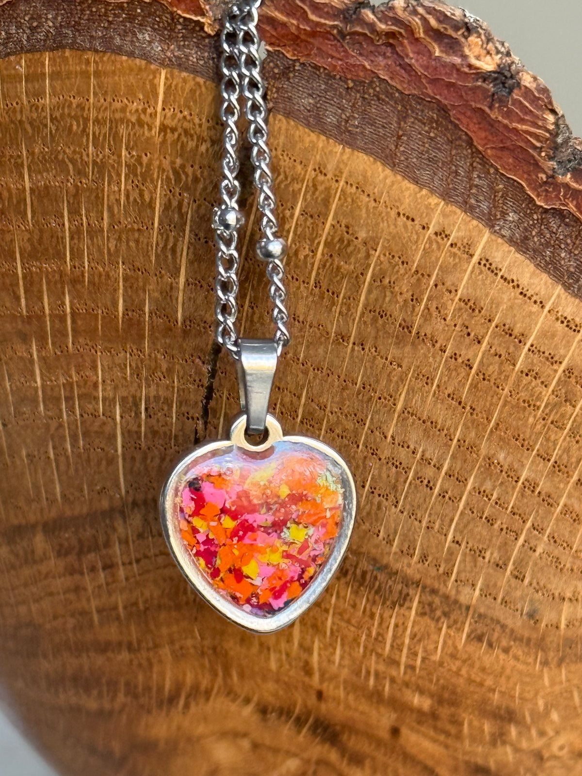 orange red and pink small heart-shaped stainless steel pendant. crayonfetti crayon jewelry by mother daughter based in atlanta , ga.