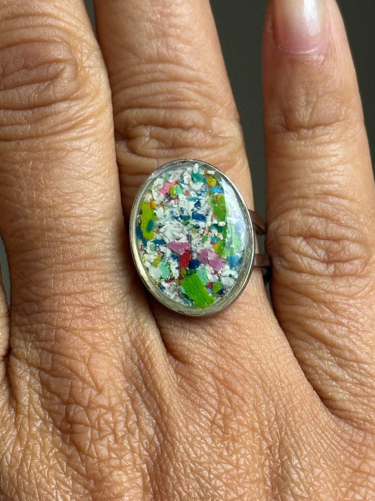 Handcrafted oval ring made with recycled crayons, featuring a polished and sophisticated silhouette. Made by mother-daughter studio in Atlanta, GA. It's crayon jewelry.