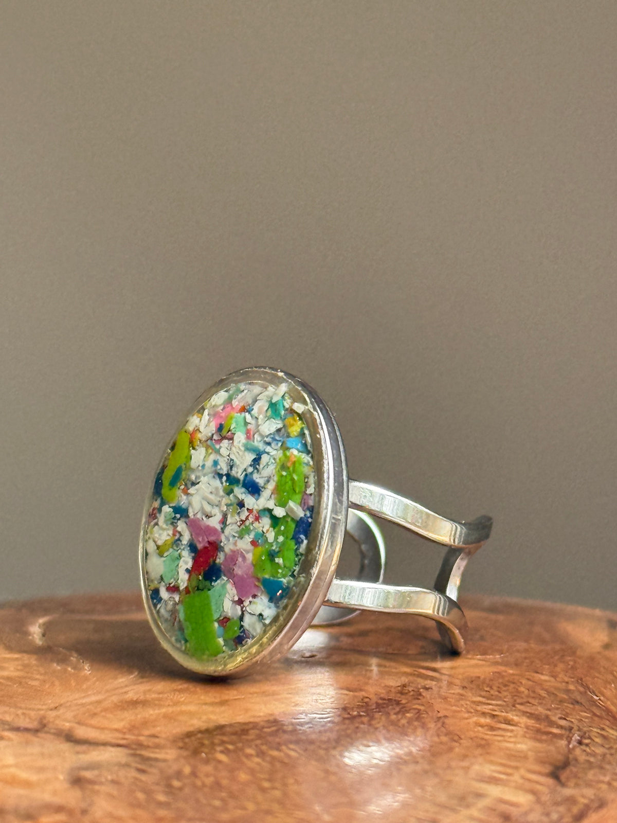 Handcrafted oval ring made with recycled crayons, featuring a polished and sophisticated silhouette. Made by mother-daughter studio in Atlanta, GA. It's crayon jewelry.