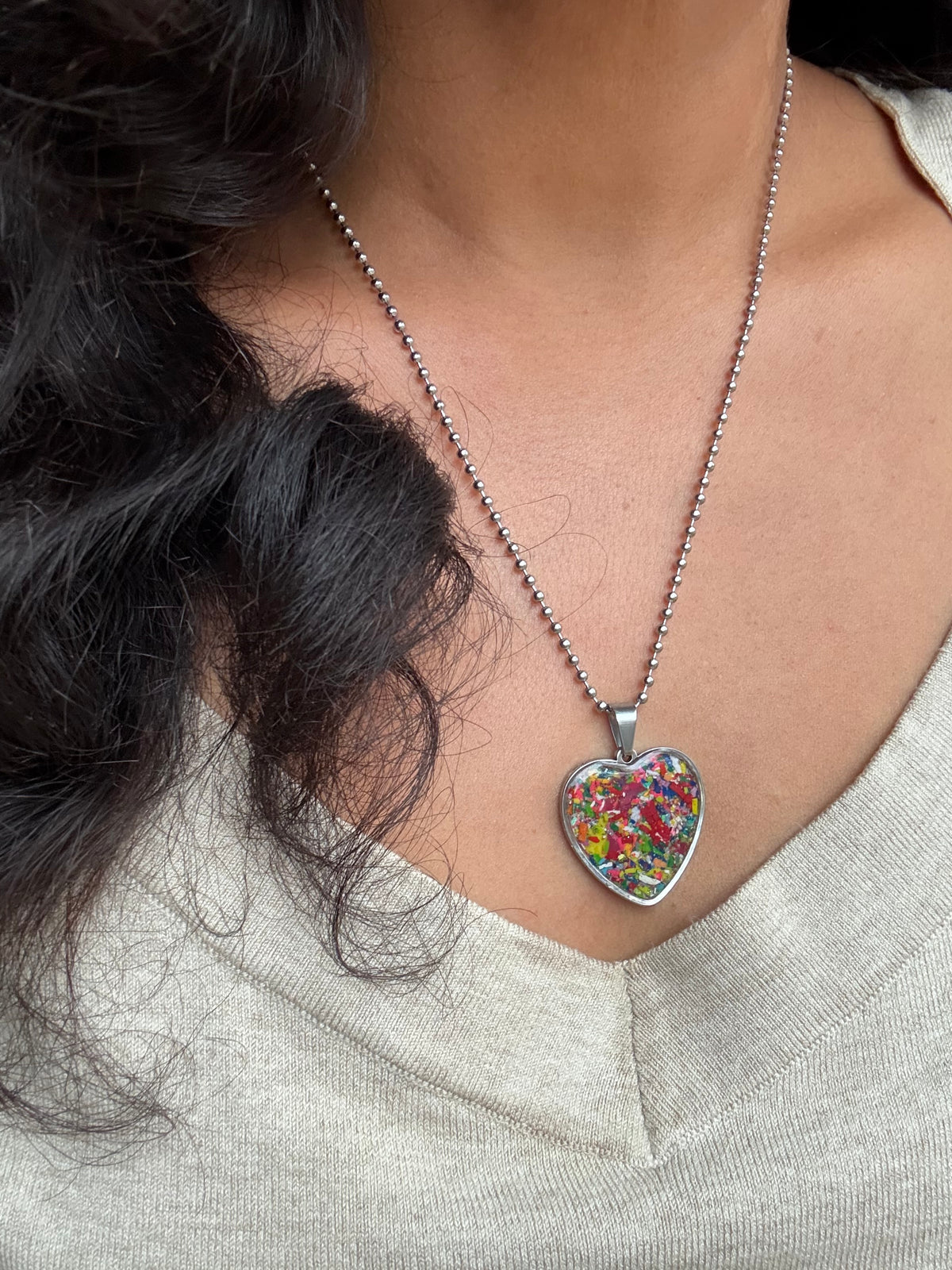 Large multicolor Viva crayon filled heart shaped stainless steel pendant. Crayon jewelry by Crayonfetti, mother-daughter based in Atlanta.