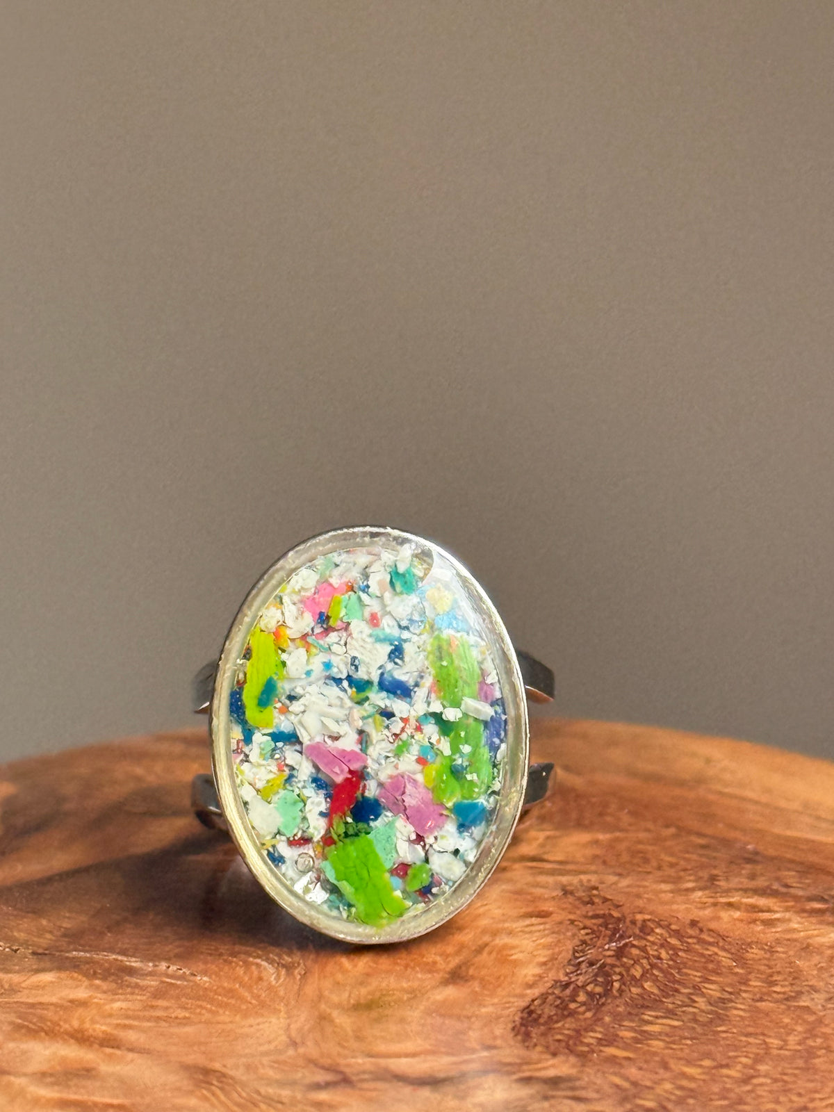 Handcrafted oval ring made with recycled crayons, featuring a polished and sophisticated silhouette. Made by mother-daughter studio in Atlanta, GA. It's crayon jewelry.