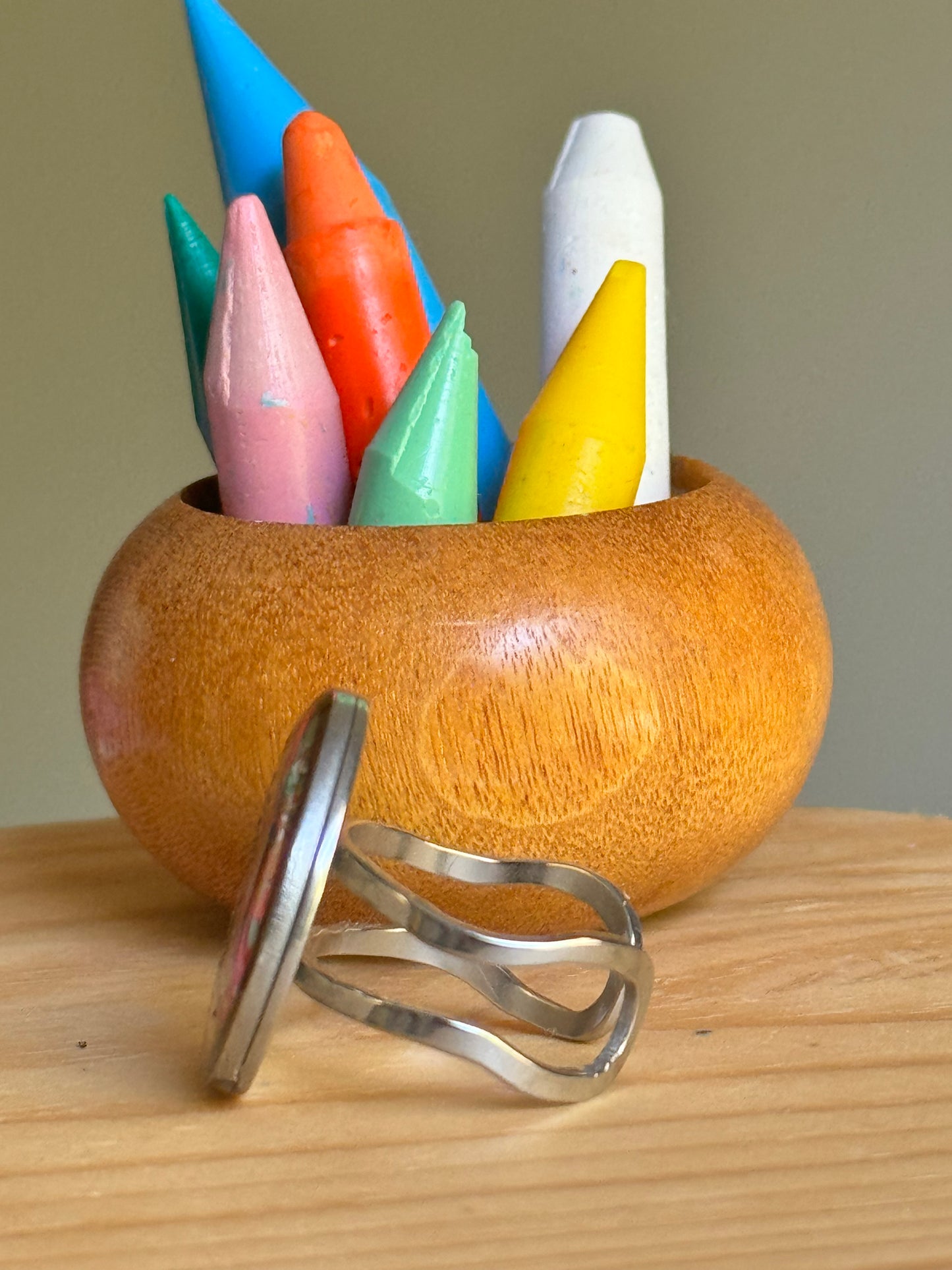 Handcrafted ring made with recycled crayons, featuring a polished and sophisticated silhouette. Made by mother-daughter studio in Atlanta, GA. It's crayon jewelry.