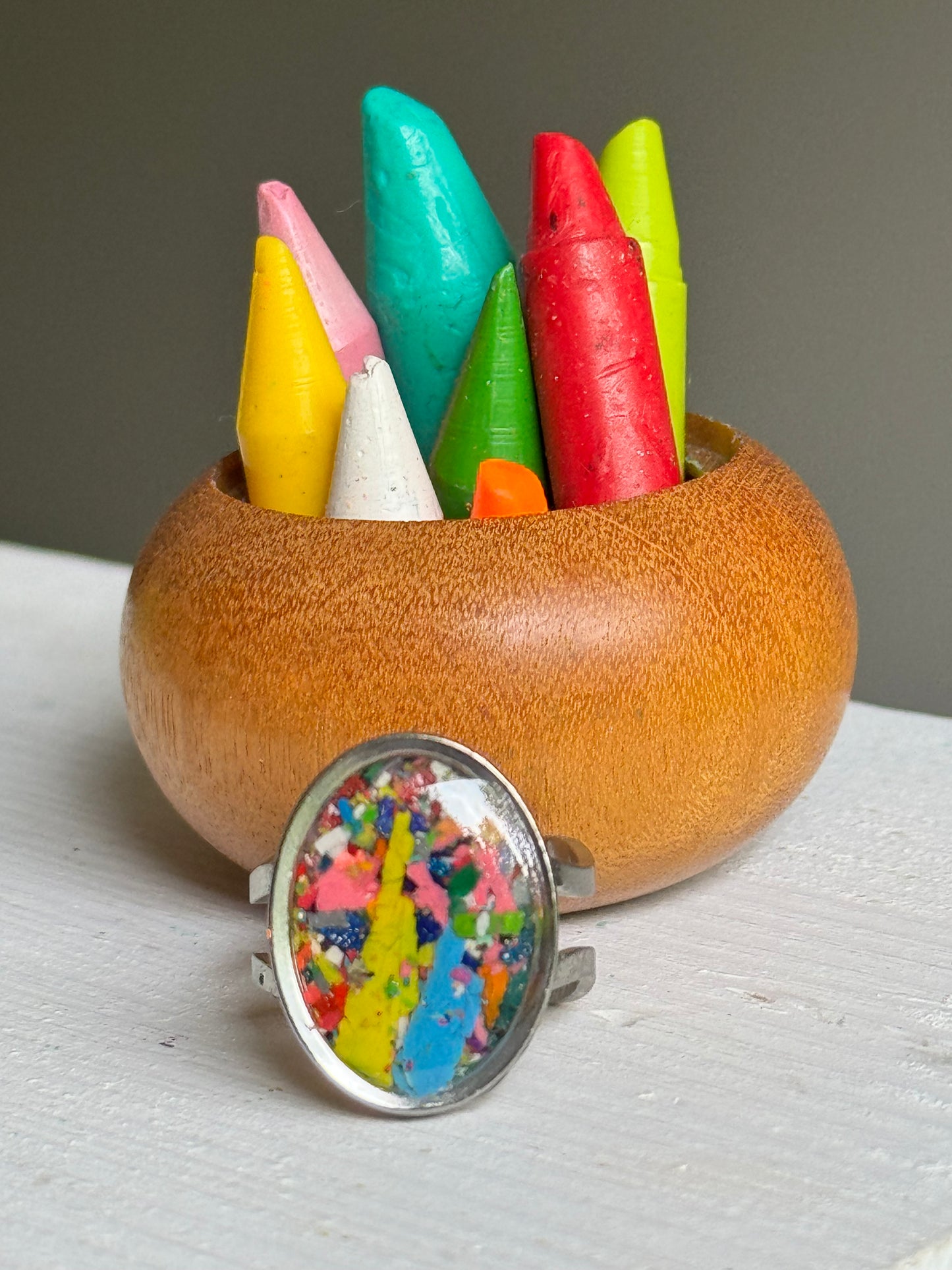 Handcrafted ring made with recycled crayons, featuring a polished and sophisticated silhouette. Made by mother-daughter studio in Atlanta, GA. It's crayon jewelry.