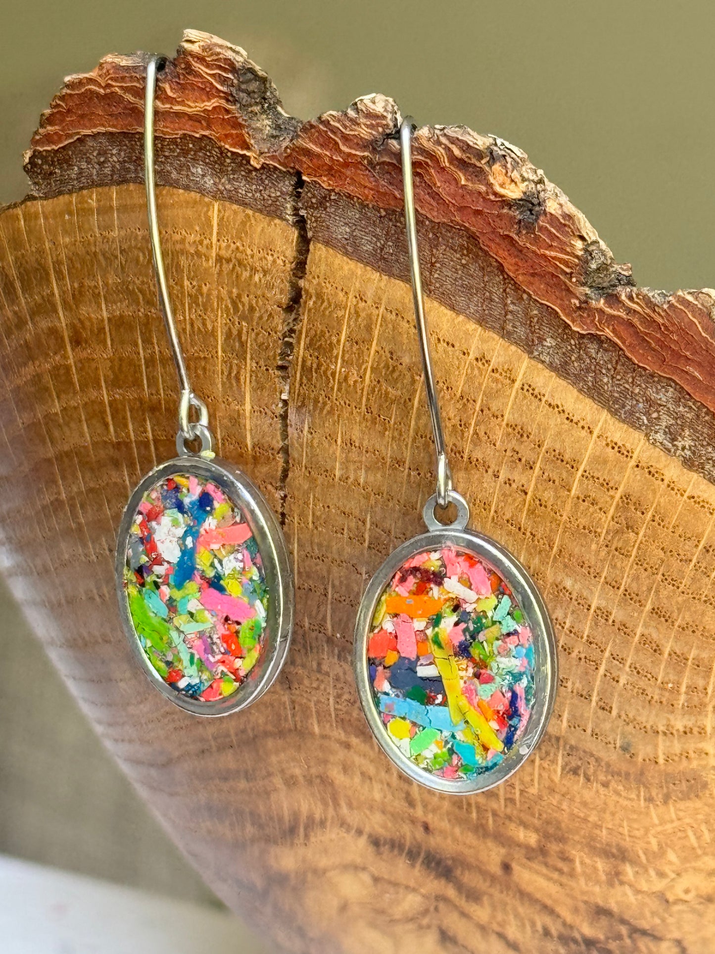 Our Prisma earrings are handcrafted with recycled crayons. Lightweight and colorful statement earrings. A vibrant and joyful sustainable jewelry statement from our mother-daughter studio in Atlanta, GA.