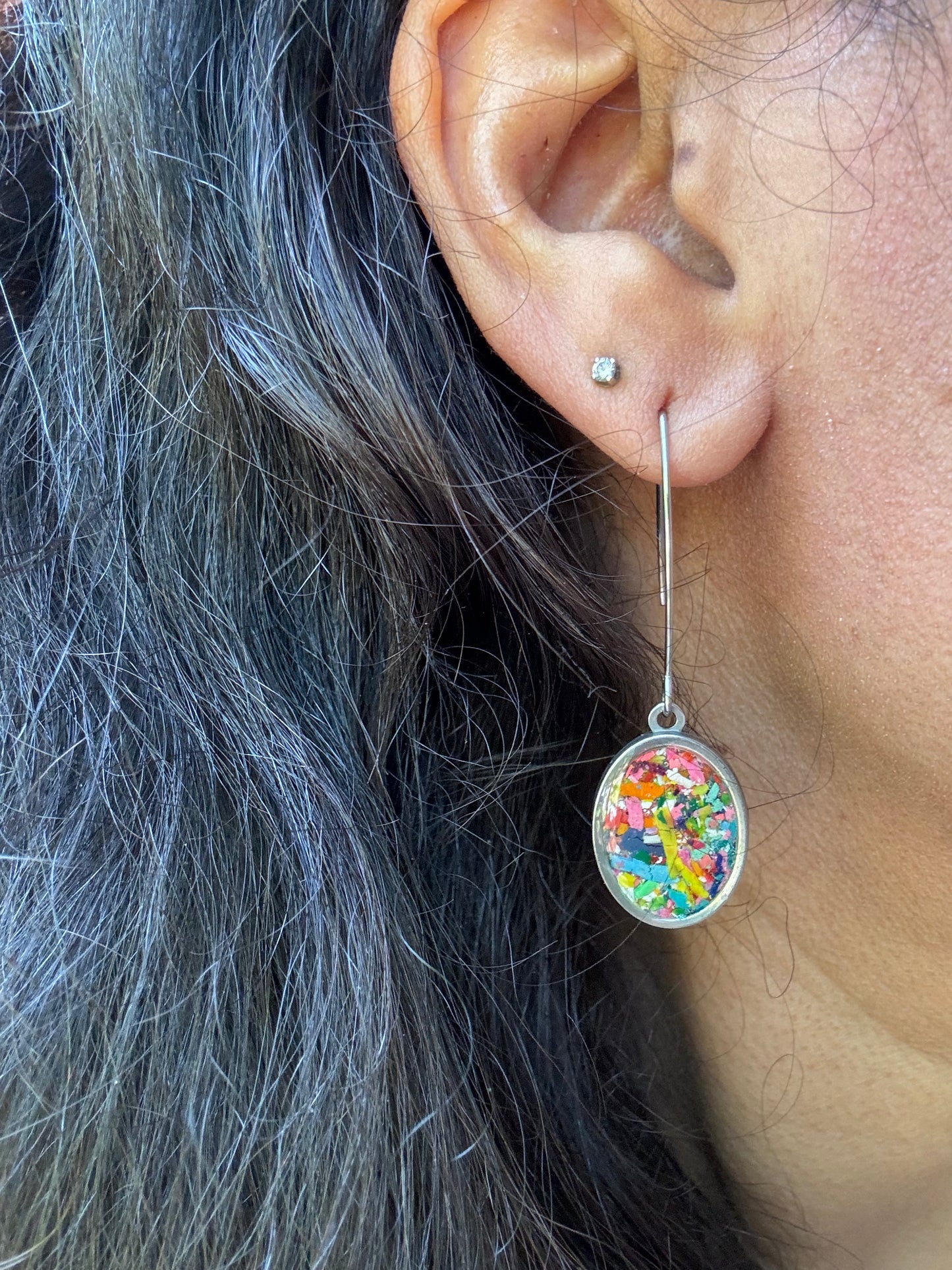 Our Prisma earrings are handcrafted with recycled crayons. Lightweight and colorful statement earrings. A vibrant and joyful sustainable jewelry statement from our mother-daughter studio in Atlanta, GA.