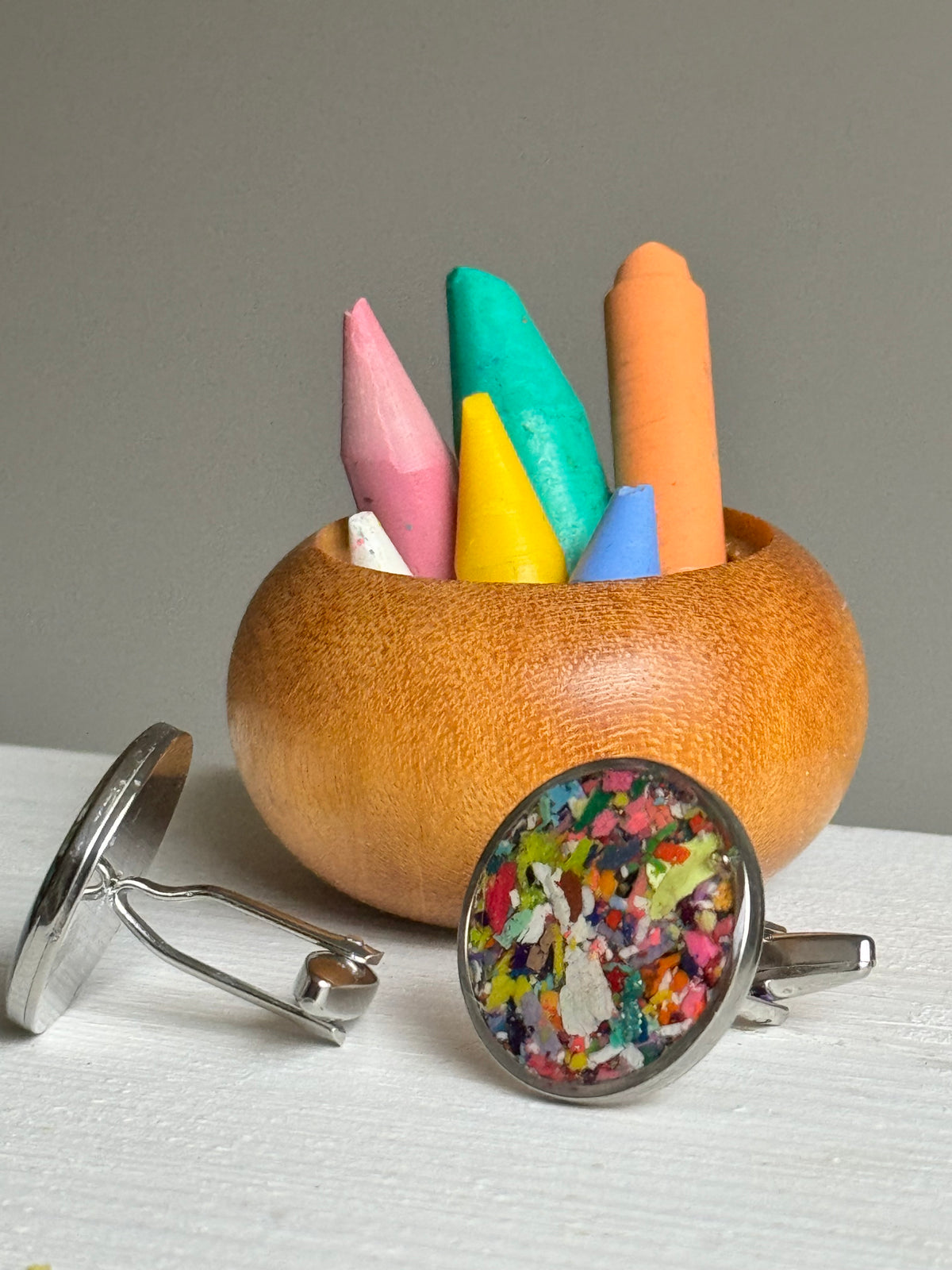 Round handcrafted cuff links made with recycled crayons in a sleek setting. A bold, joyful accessory from our mother-daughter studio in Atlanta, GA.
