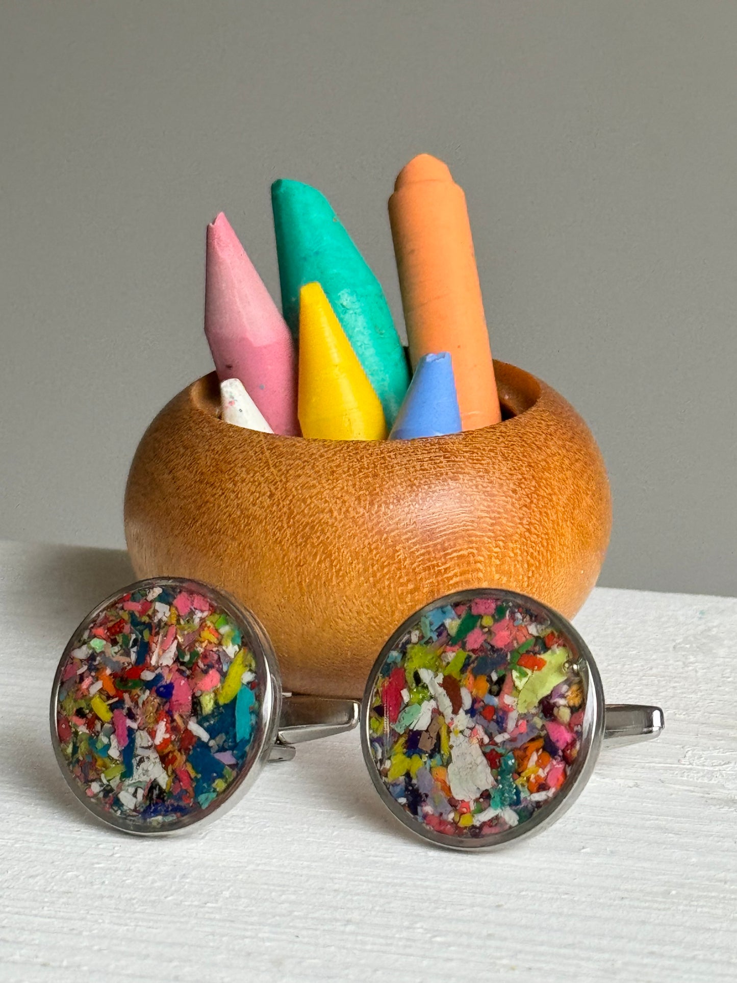 Round handcrafted cuff links made with recycled crayons in a sleek setting. A bold, joyful accessory from our mother-daughter studio in Atlanta, GA.
