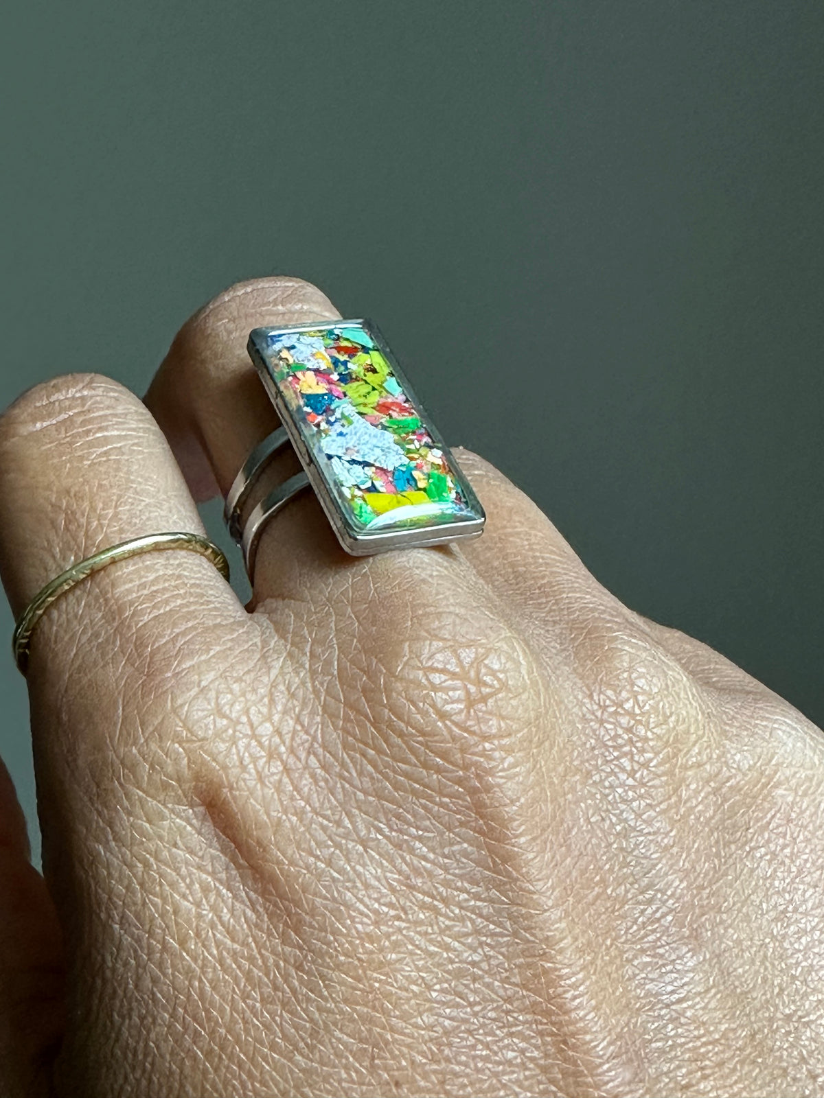 Handcrafted ring made with recycled crayons, featuring a polished and sophisticated silhouette. Made by mother-daughter studio in Atlanta, GA. It's crayon jewelry.