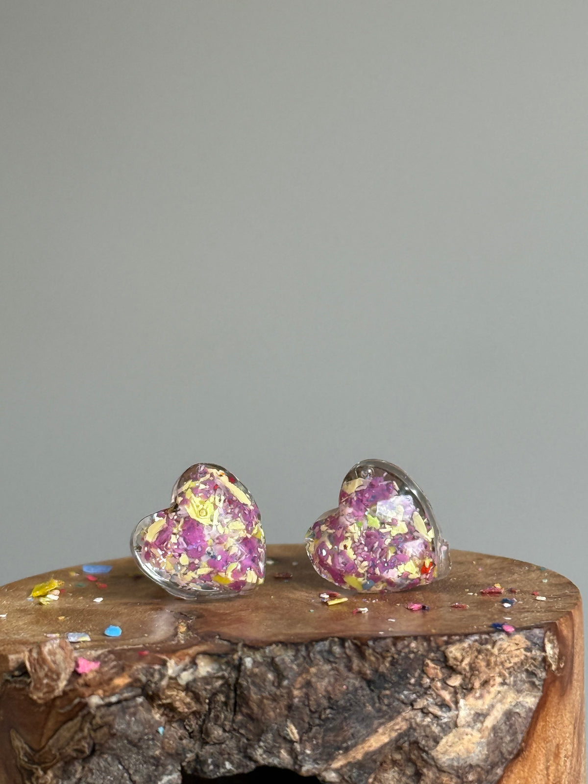 small colorful studs made with recycled crayons. Our crayon jewelry are a joyful pop-of-color made from our mother-daughter studio in Atlanta, GA.