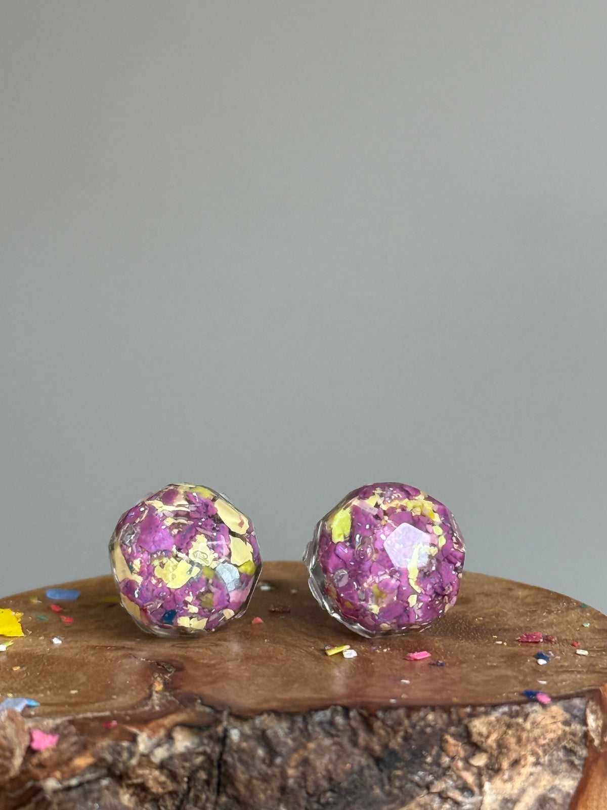 small colorful studs made with recycled crayons. Our crayon jewelry are a joyful pop-of-color made from our mother-daughter studio in Atlanta, GA.