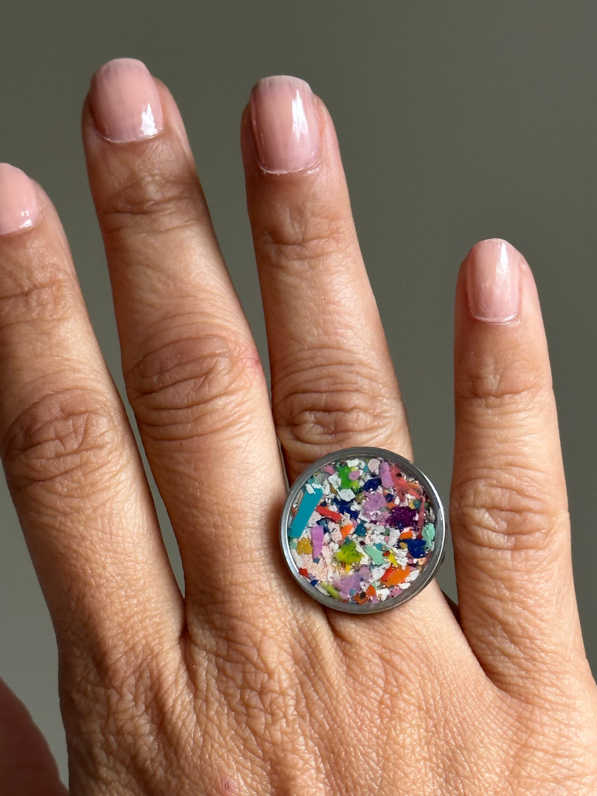 Handcrafted ring made with recycled crayons, featuring a polished and sophisticated silhouette. Made by mother-daughter studio in Atlanta, GA. It's crayon jewelry.