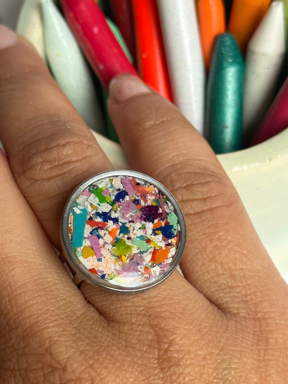 Handcrafted ring made with recycled crayons, featuring a polished and sophisticated silhouette. Made by mother-daughter studio in Atlanta, GA. It's crayon jewelry.