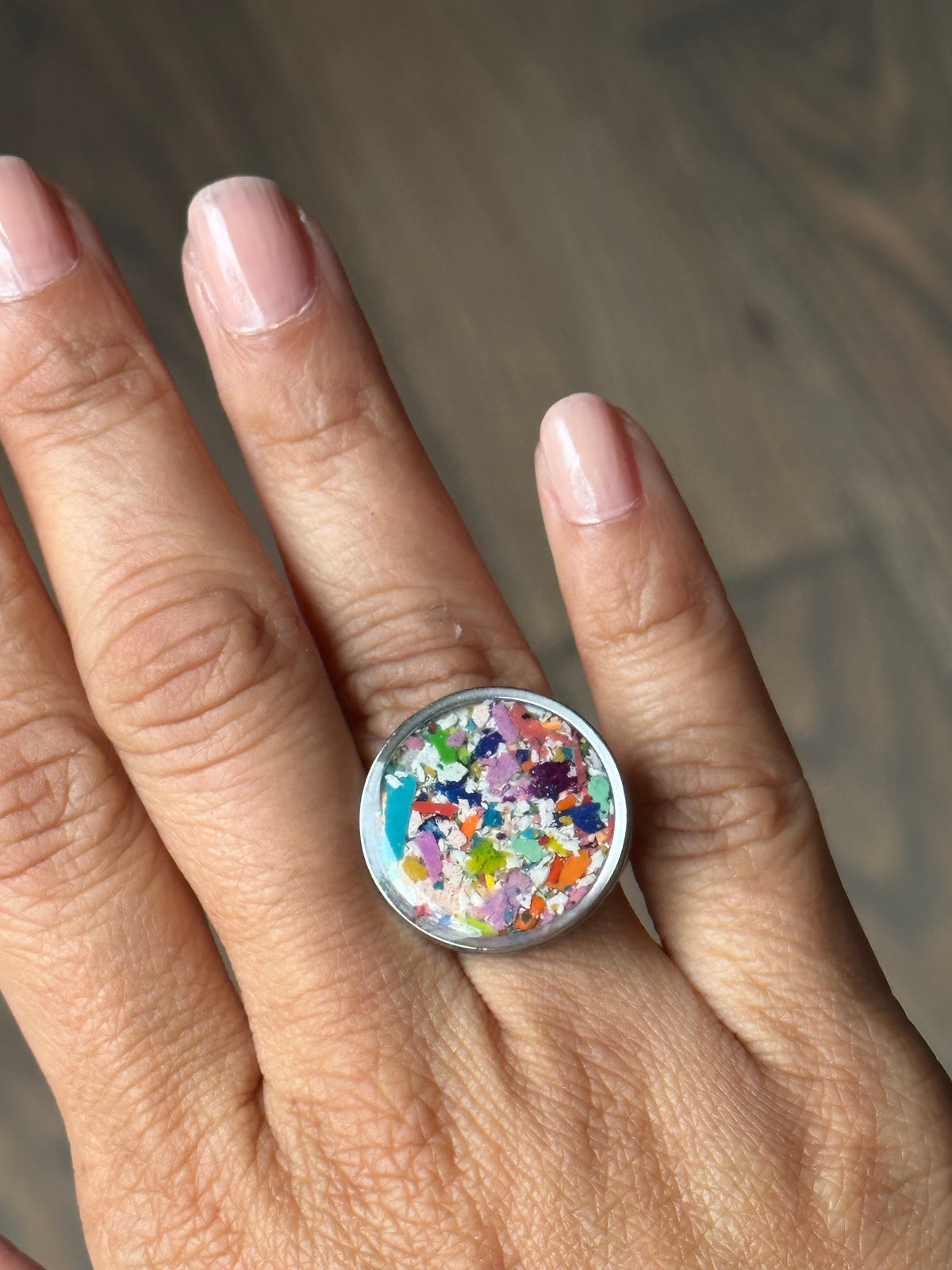 Handcrafted ring made with recycled crayons, featuring a polished and sophisticated silhouette. Made by mother-daughter studio in Atlanta, GA. It's crayon jewelry.