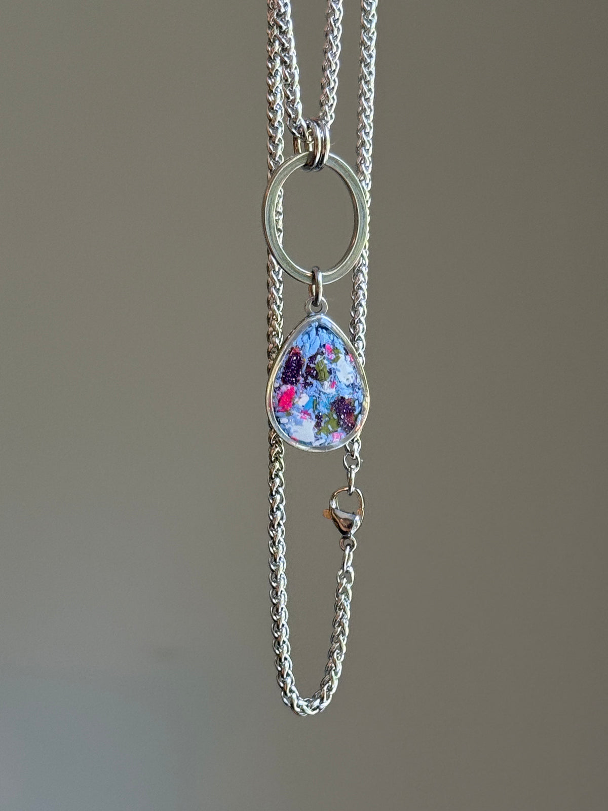 Periwinkle purple Carmen necklace with a colorful reclaimed crayon pendant hanging on a stainless steel chain. Crayon jewelry.