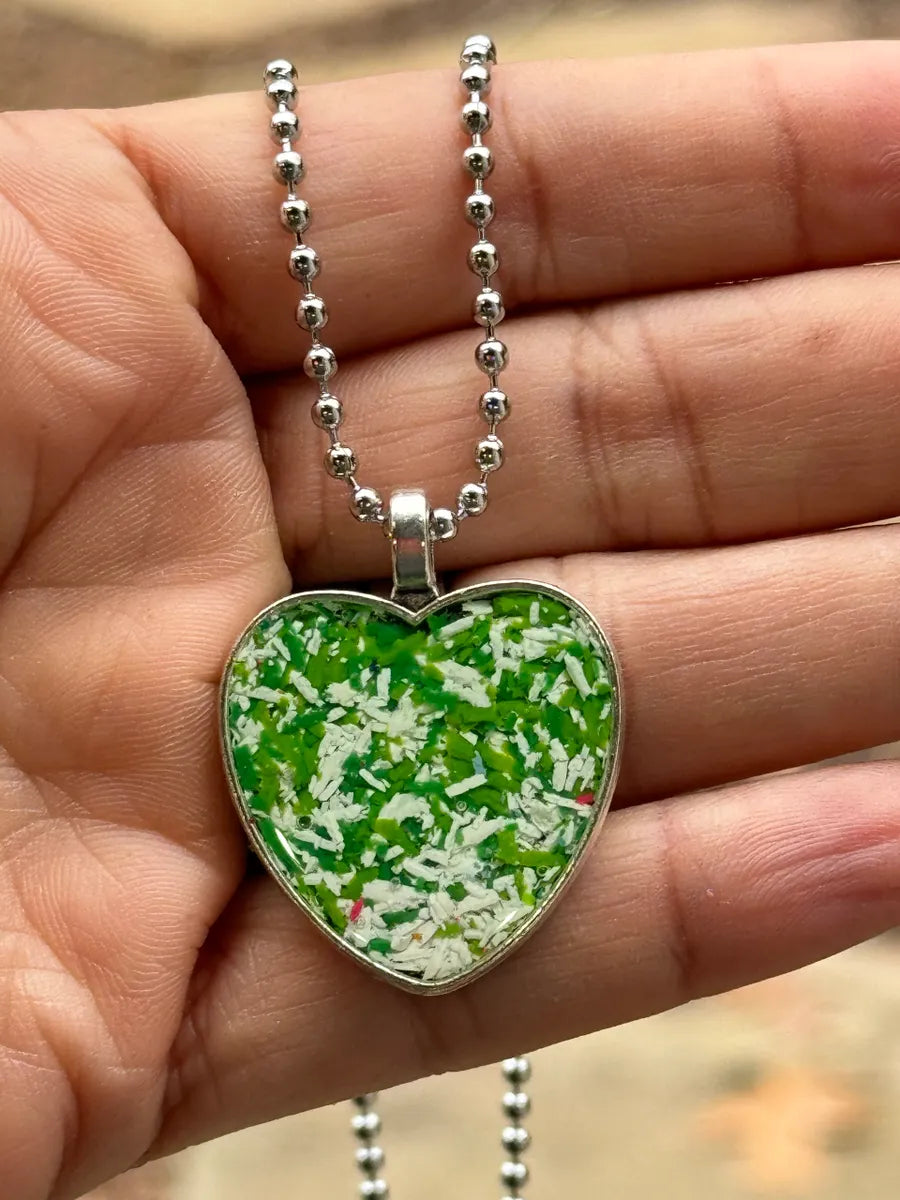 heart pendant filled with crayon shavings by crayonfetti