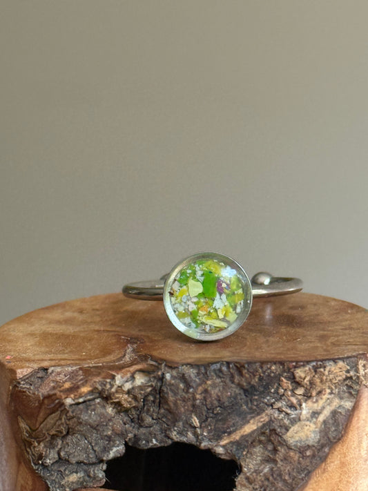 small ring filled with crayons in pinks, greens and white.  crayon jewelry by crayonfetti
