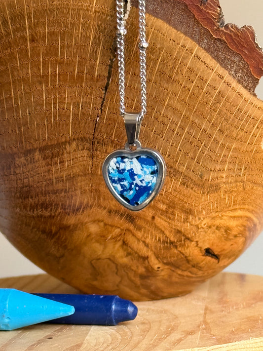 Blue and white small heart stainless steel pendant filled with crayon shavings. Dainty necklace. Crayonfetti crayon jewelry by mother-daughter based in Atlanta, Georgia.