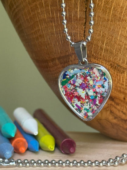 Moxie vibrant multicolor crayon shavings heart necklace handmade statement jewelry. Crayon jewelry by Crayonfetti, mother-daughter based in Atlanta.