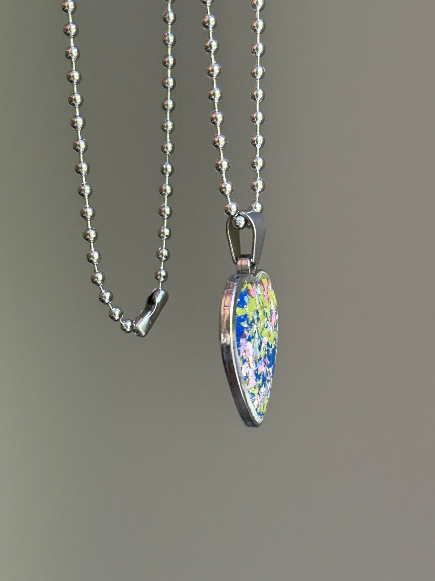 crayon shavings heart pendant necklace colorful statement piece. Crayon jewelry by Crayonfetti, mother-daughter based in Atlanta.
