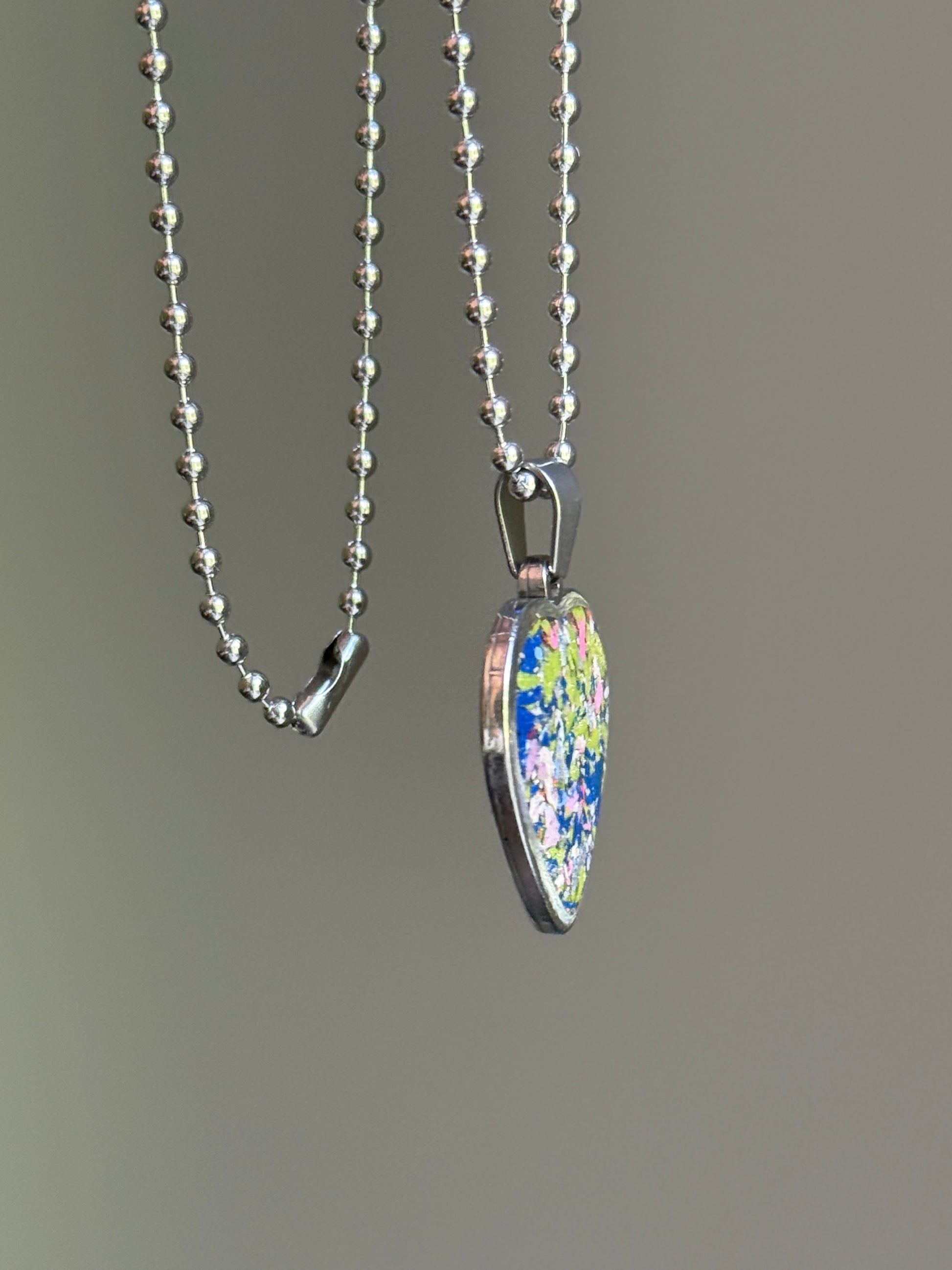 crayon shavings heart pendant necklace colorful statement piece. Crayon jewelry by Crayonfetti, mother-daughter based in Atlanta.