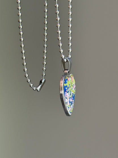 crayon shavings heart pendant necklace colorful statement piece. Crayon jewelry by Crayonfetti, mother-daughter based in Atlanta.
