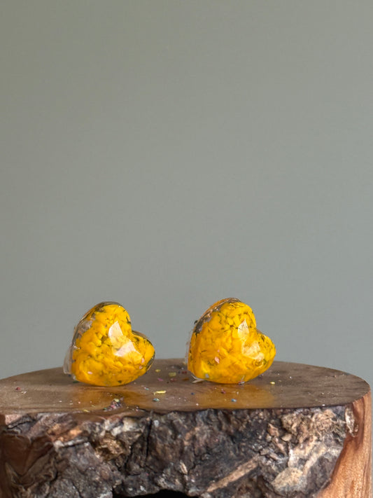 small colorful studs made with recycled crayons in dandelion color. Our crayon jewelry are a joyful pop-of-color made from our mother-daughter studio in Atlanta, GA.