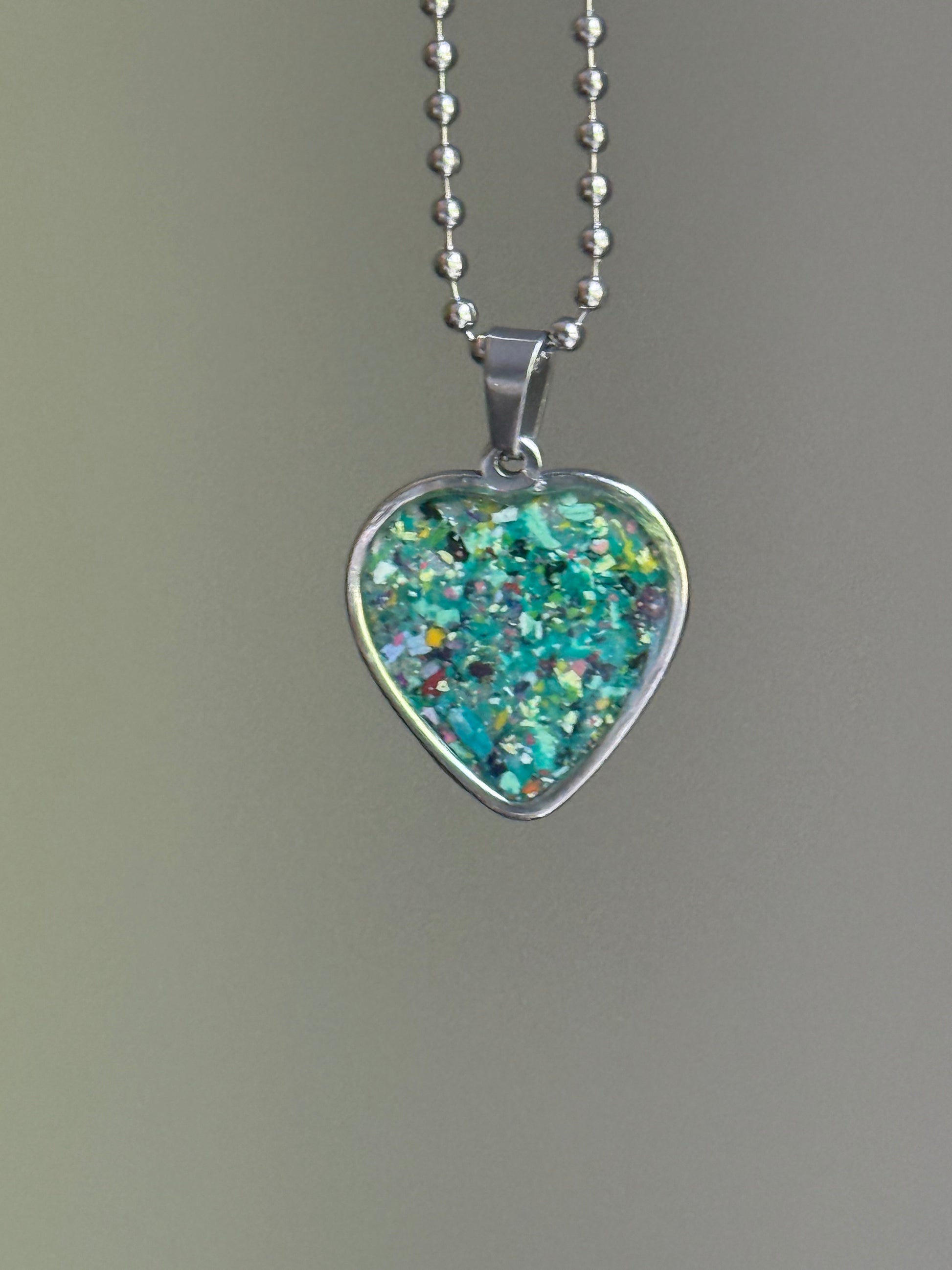nature-inspired crayon shavings heart pendant colorful upcycled necklace. Crayon jewelry by Crayonfetti, mother-daughter based in Atlanta.