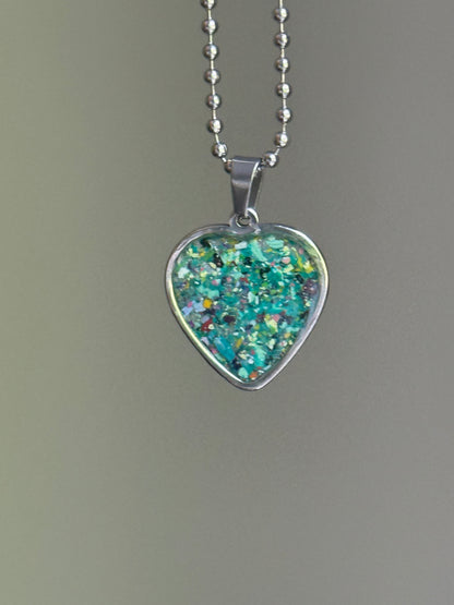nature-inspired crayon shavings heart pendant colorful upcycled necklace. Crayon jewelry by Crayonfetti, mother-daughter based in Atlanta.