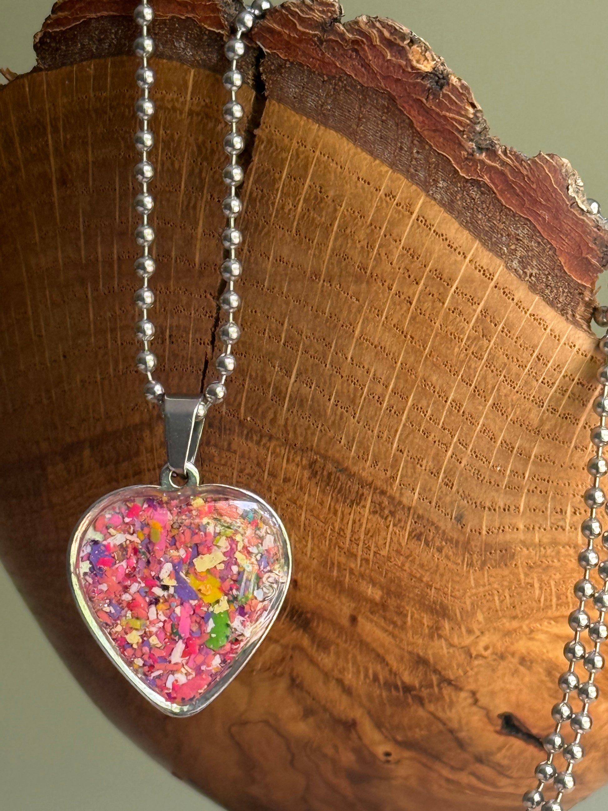Punk Rose pink black crayon shavings heart necklace handmade statement jewelry. Crayon jewelry by Crayonfetti, mother-daughter based in Atlanta.