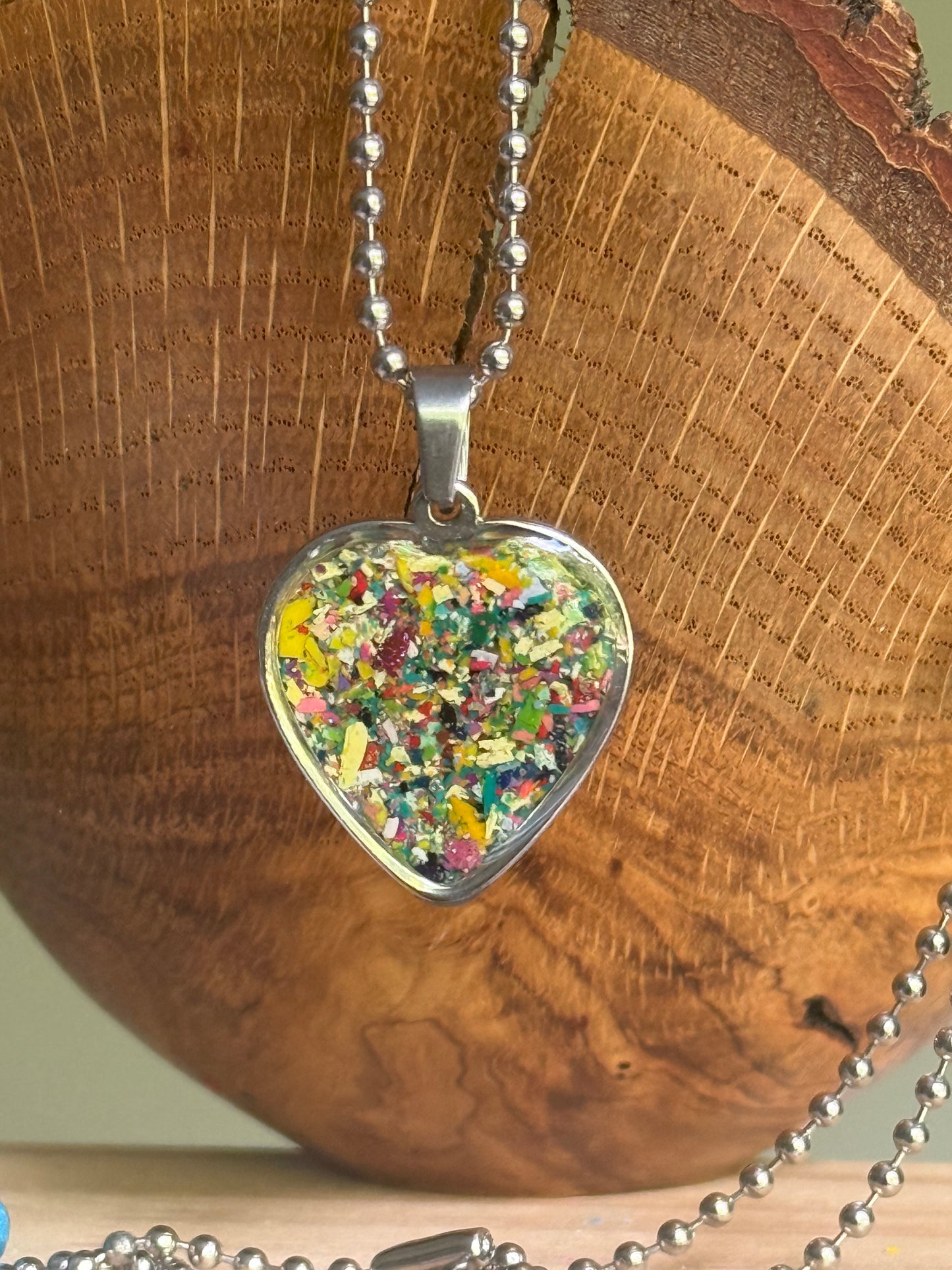 crayon shavings heart necklace handmade wearable art upcycled jewelry. Crayon jewelry by Crayonfetti, mother-daughter based in Atlanta.