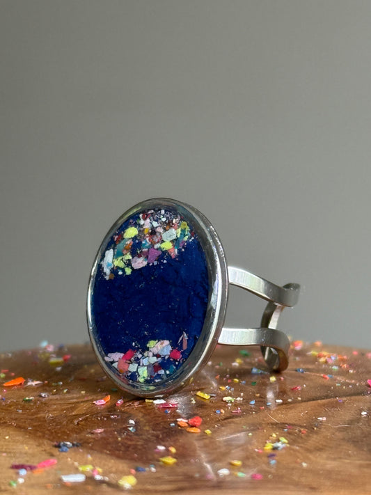 oval handmade crayon shavings ring in dark tones. Crayon jewelry by mother-daughter based in Atlanta, GA.