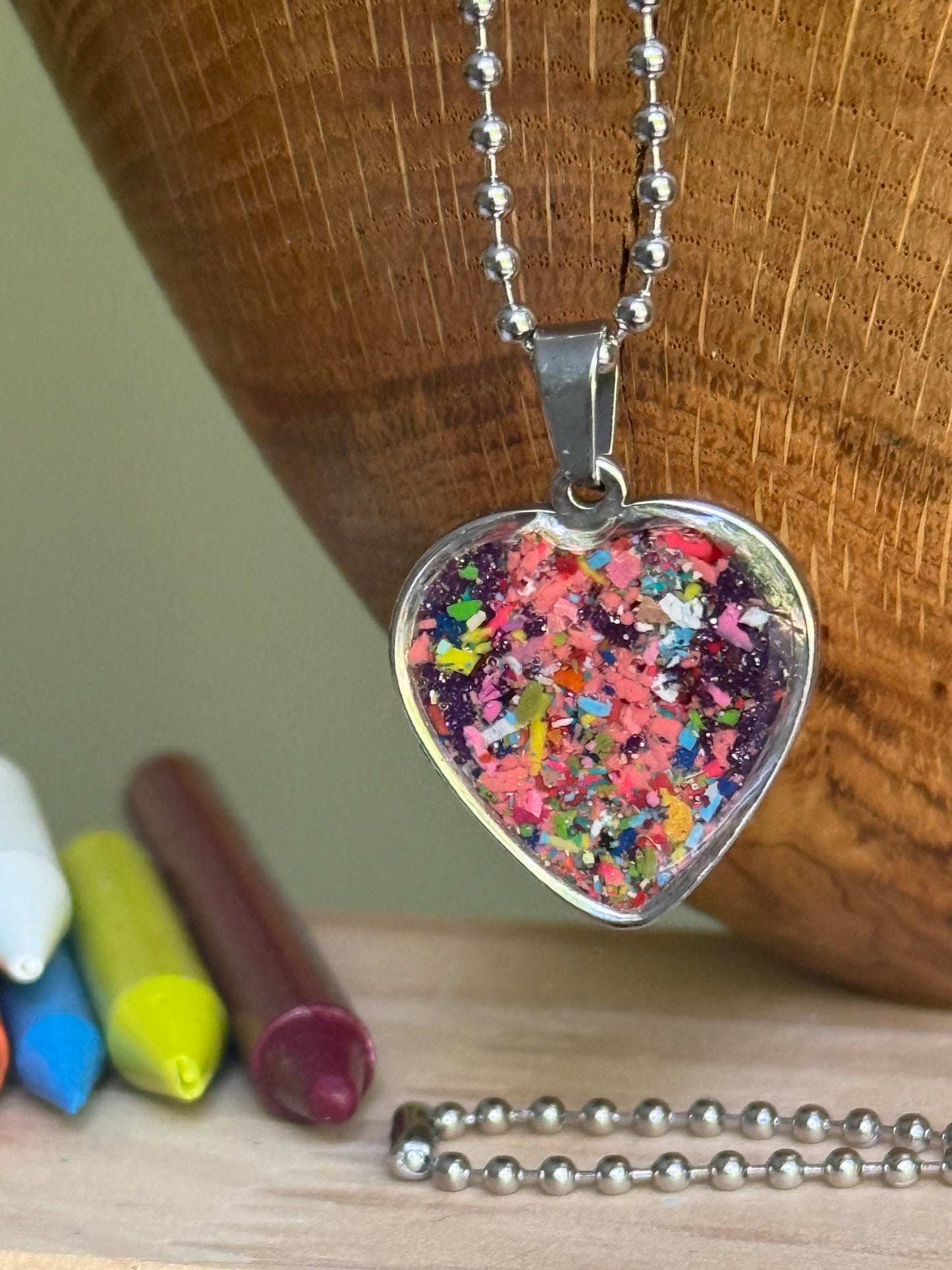Royal jewel-toned crayon shavings heart necklace handmade statement jewelry. Crayon jewelry by Crayonfetti, mother-daughter based in Atlanta.