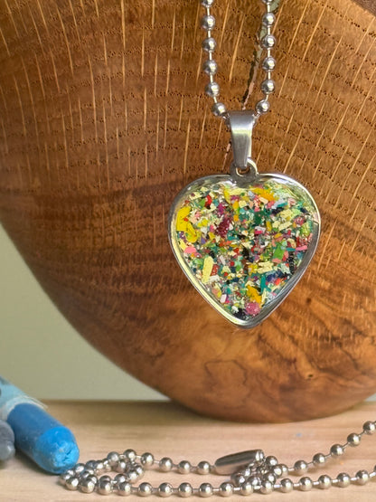 Storm grey blue crayon shavings heart necklace handmade statement jewelry. Crayon jewelry by Crayonfetti, mother-daughter based in Atlanta.