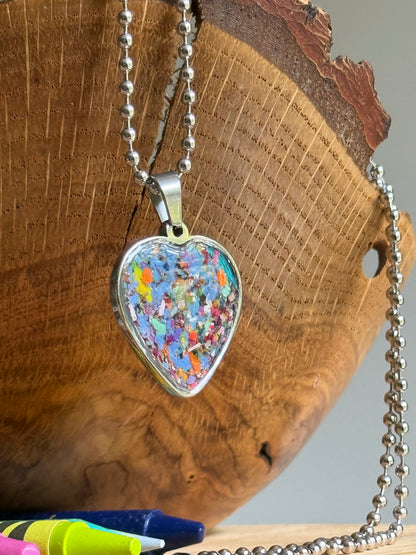 Close up and side view of our crayon heart pendant by crayonfetti.  crayon jewelry