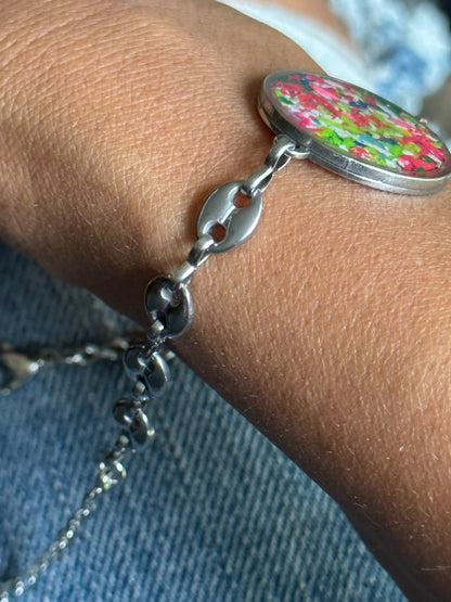 Durable stainless steel bracelet with a bright multicolor crayon design.