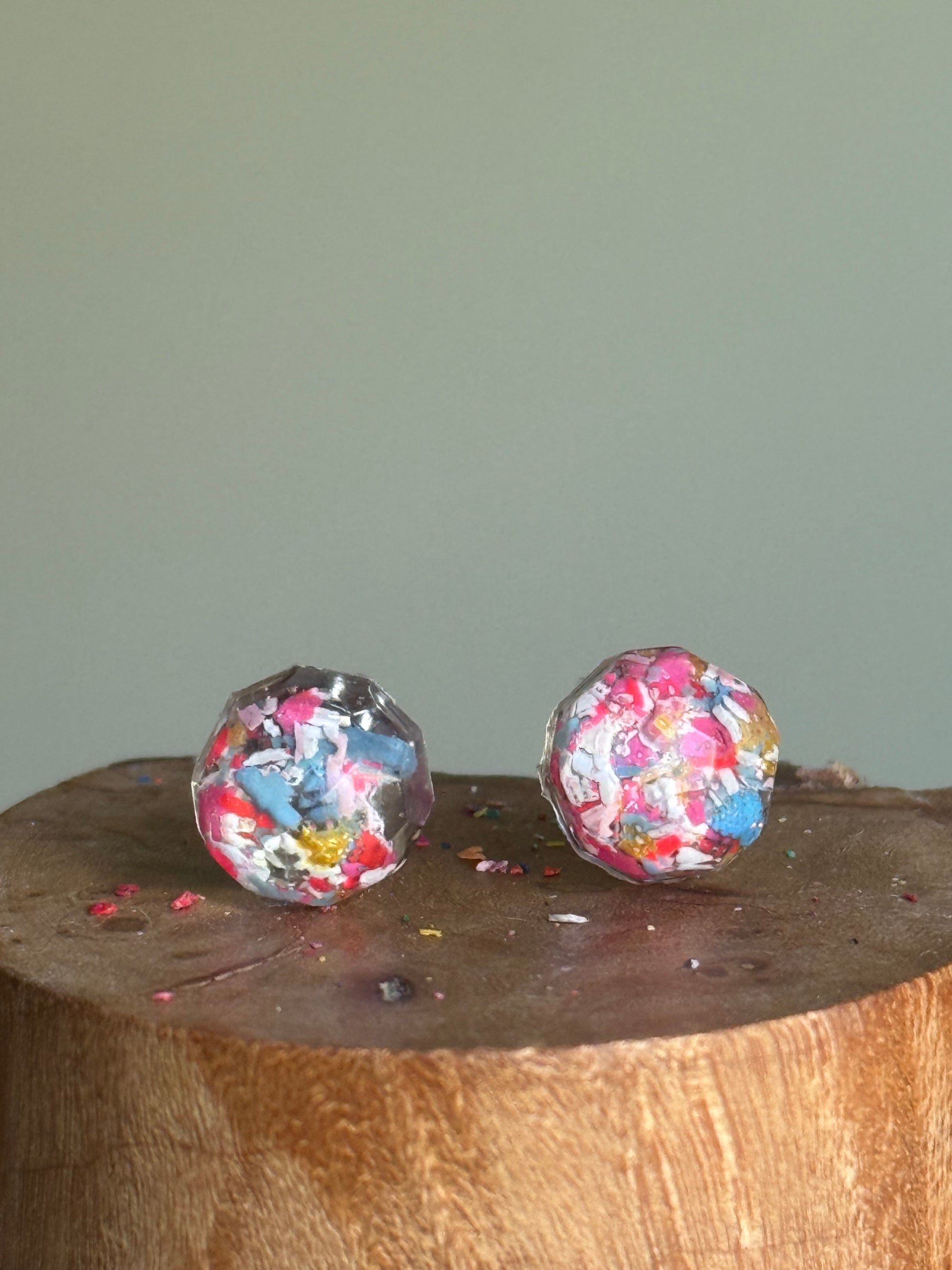 small colorful studs made with recycled crayons. Our crayon jewelry are a joyful pop-of-color made from our mother-daughter studio in Atlanta, GA.