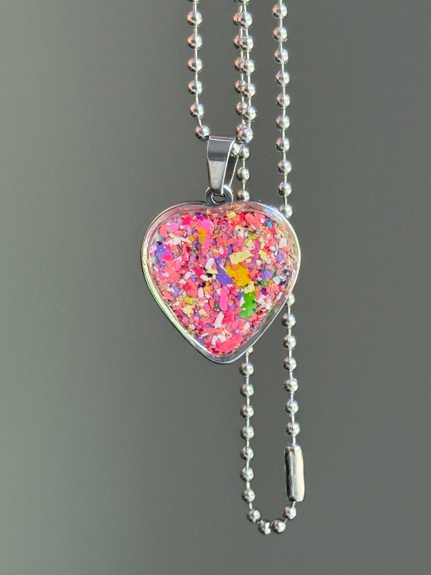 bold pink crayon shavings heart pendant colorful upcycled necklace. Crayon jewelry by Crayonfetti, mother-daughter based in Atlanta.