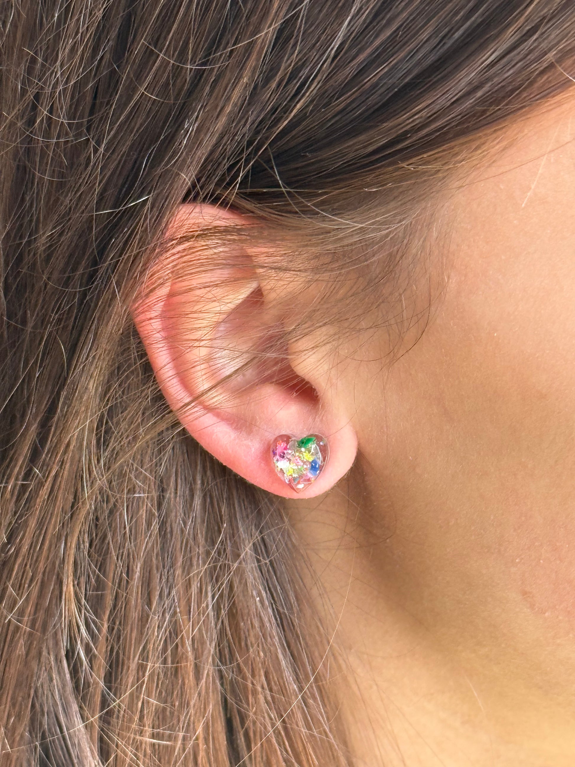 small colorful studs made with recycled crayons. Our crayon jewelry are a joyful pop-of-color made from our mother-daughter studio in Atlanta, GA.