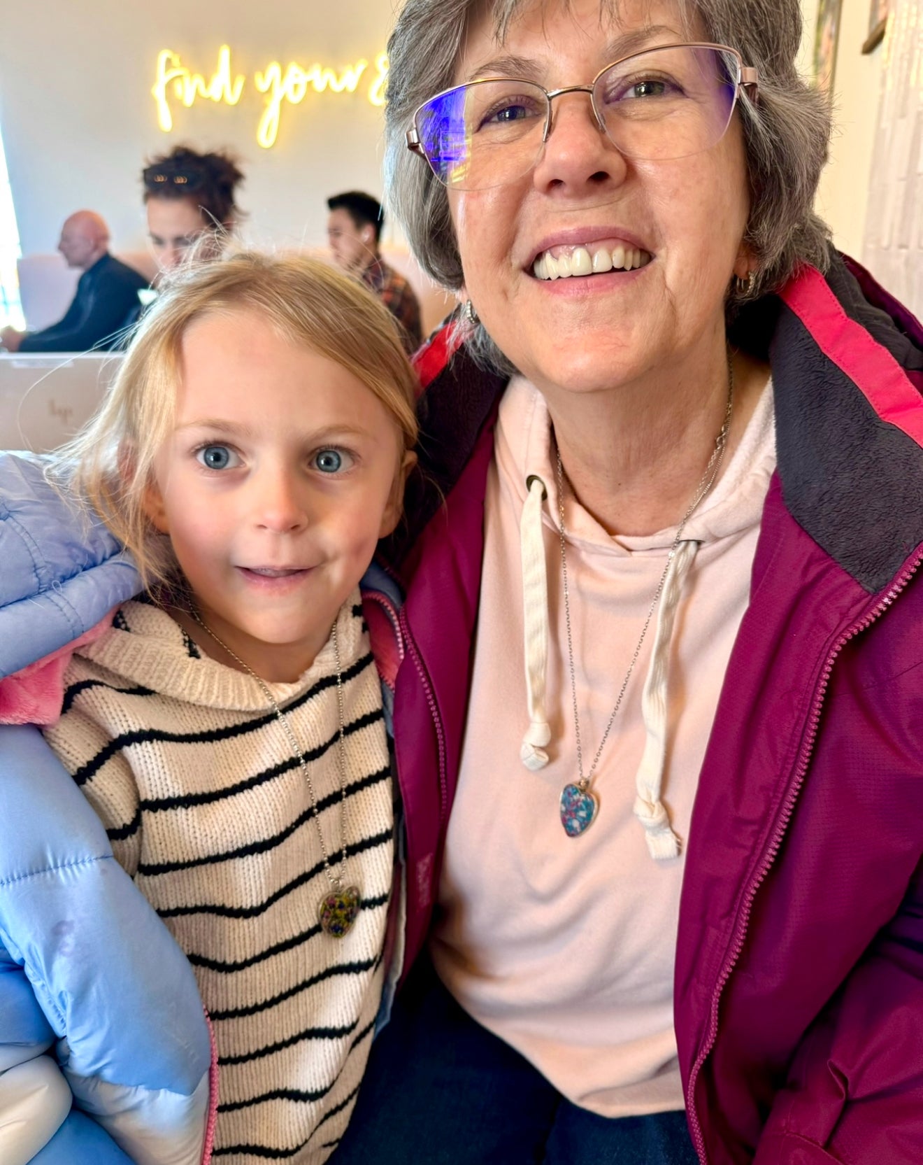 grandma and grandaughter wearing heart pendants