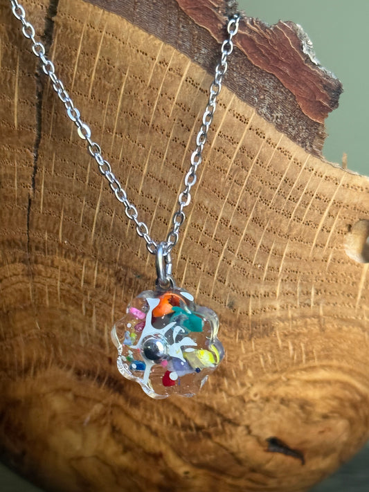 clear flower pendant handcrafted with crayons.  Chain included.  Crayonfetti crayon jewelry by mother daughter based in Atlanta